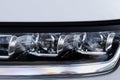 Modern car headlight close up view. Royalty Free Stock Photo