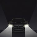 Modern car headlights shining brightly in dark tunnel setting Royalty Free Stock Photo