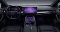 Modern car interior with black leather steering wheel and dashboard featuring large touch screen display and purple background Royalty Free Stock Photo