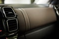 Modern car interior with close-up of ventilation system holes and air conditioning. Concept wallpaper for auto air Royalty Free Stock Photo