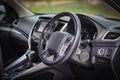 Modern car interior dashboard and steering wheel, close-up