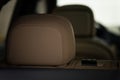 Modern car interior detail. Leather headrest. Royalty Free Stock Photo