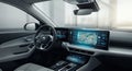 A sleek car interior showcases a large digital dashboard and touchscreen display Royalty Free Stock Photo