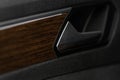 Modern car interior door handle close up. Royalty Free Stock Photo