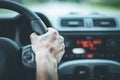 Modern car interior: Male hands on a sports car steering wheel Royalty Free Stock Photo