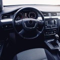 Modern car interior. Steering wheel, dashboard, speedometer, display. Royalty Free Stock Photo