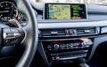 Modern car interior, steering wheel with media phone control buttons, navigation, screen multimedia system background,