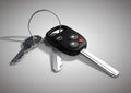 Modern Car keys for passenger vehicle isolated on flat white surface.