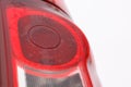 Modern car rear headlight close view with droplets on it. Royalty Free Stock Photo