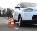 Modern car and safety cones Royalty Free Stock Photo