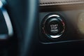 Modern car start and stop engine button - closeup of modern dashboard of modern day car, technology and safety power button Royalty Free Stock Photo