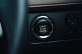 Modern car start and stop engine button - closeup of modern dashboard of modern day car, technology and safety power button Royalty Free Stock Photo