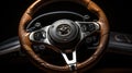 Modern car steering wheel on black background. Steering wheel on a leather car interior