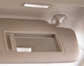 Modern car sun visor with mirror, close-up. Sunshield Royalty Free Stock Photo