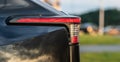 Modern car tail light detail at dusk.. Royalty Free Stock Photo