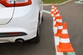 Modern car on test track with traffic cones, closeup. Driving school Royalty Free Stock Photo