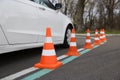 Modern car on test track with traffic cones, closeup. Driving school Royalty Free Stock Photo