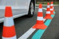 Modern car on test track with traffic cones, closeup. Driving school Royalty Free Stock Photo