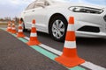 Modern car on test track with traffic cones, closeup. Driving school Royalty Free Stock Photo