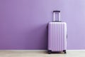 Modern Carry-On Suitcase Against an Purple Backdrop Ai Generated Illustration