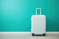 Modern Carry-On Suitcase Against Turquoise Backdrop Ai Generated Illustration