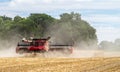 Modern case combine harvester cutting crops Royalty Free Stock Photo