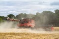 Modern case combine harvester cutting crops Royalty Free Stock Photo