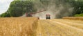 Modern case combine harvester cutting crops