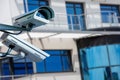 Modern CCTV camera on the wall of an industrial building