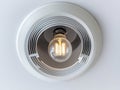 Modern ceiling light fixture with exposed bulb and air vent design Royalty Free Stock Photo