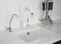Modern ceramic kitchen sink. Modern kitchen chrome faucet and mosaic tiles wall