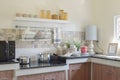 Modern ceramic kitchenware and utensils on the black granite countertop Royalty Free Stock Photo
