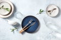 Modern ceramic tableware, overhead flat lay shot with olive branches
