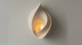Modern ceramic wall light fixture with warm glow. Interior design and home decor concept Royalty Free Stock Photo