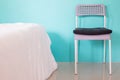 Modern chair in blue bedroom at home, copy space