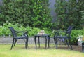 Modern chair and table set at green garden Royalty Free Stock Photo