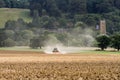 Modern Challenger tractor cultivating English crop field