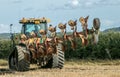 Modern Challenger tractor ploughing English crop field