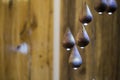 Modern chandelier, many small pendant lights in the form of drops of wood, eco style interior design Royalty Free Stock Photo