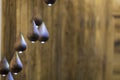 Modern chandelier, many small pendant lights in the form of drops of wood, eco style interior design Royalty Free Stock Photo