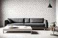 A modern charcoal-gray sofa sitting against a minimalist white brick wall, bathed in soft natural light