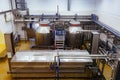 Modern cheese factory, stainless steel milk processing tanks