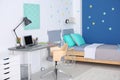 Modern child room interior with comfortable bed Royalty Free Stock Photo