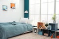 Modern child room interior with bed near window Royalty Free Stock Photo