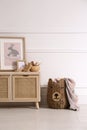 Modern child room interior with wooden cabinet and different accessories. Space for text Royalty Free Stock Photo