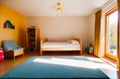 Modern children's colorful room with yellow walls on a sunny day with sunlight through the windows with a mountain Royalty Free Stock Photo