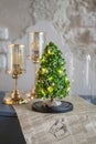 Modern christmas decoration table display. Cute little festive glas Cloche filled with green hydrangea flowers Royalty Free Stock Photo