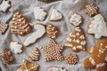 Modern Christmas gingerbread cookies on rustic napkin flat lay. Atmospheric moody image. Stylish decorated christmas gingerbread