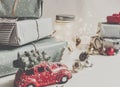 Modern christmas ornaments and car toy with tree, presents cones Royalty Free Stock Photo