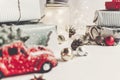 Modern christmas ornaments and car toy with tree, presents cones Royalty Free Stock Photo